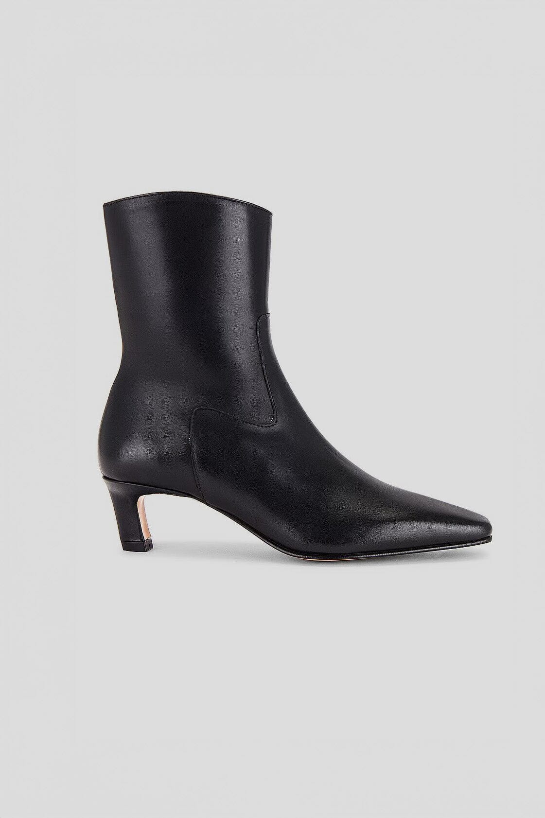 Side view of Alohas black kitten heeled Nash ankle boots