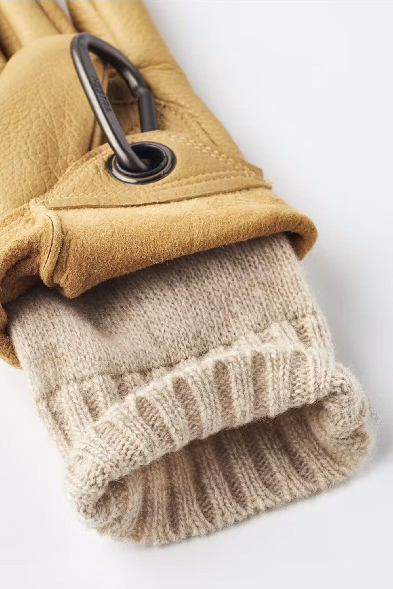 Tan leather gloves with a wool interior