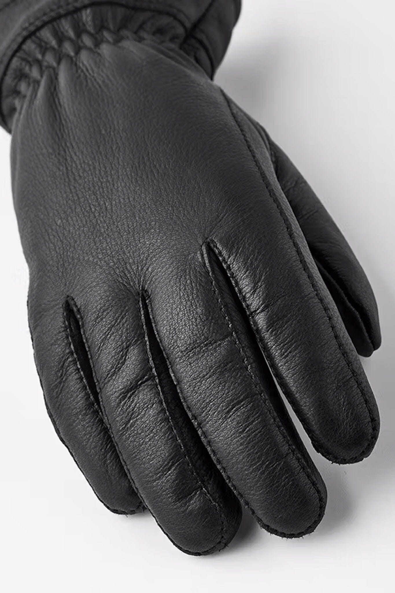 Black leather gloves on a white background