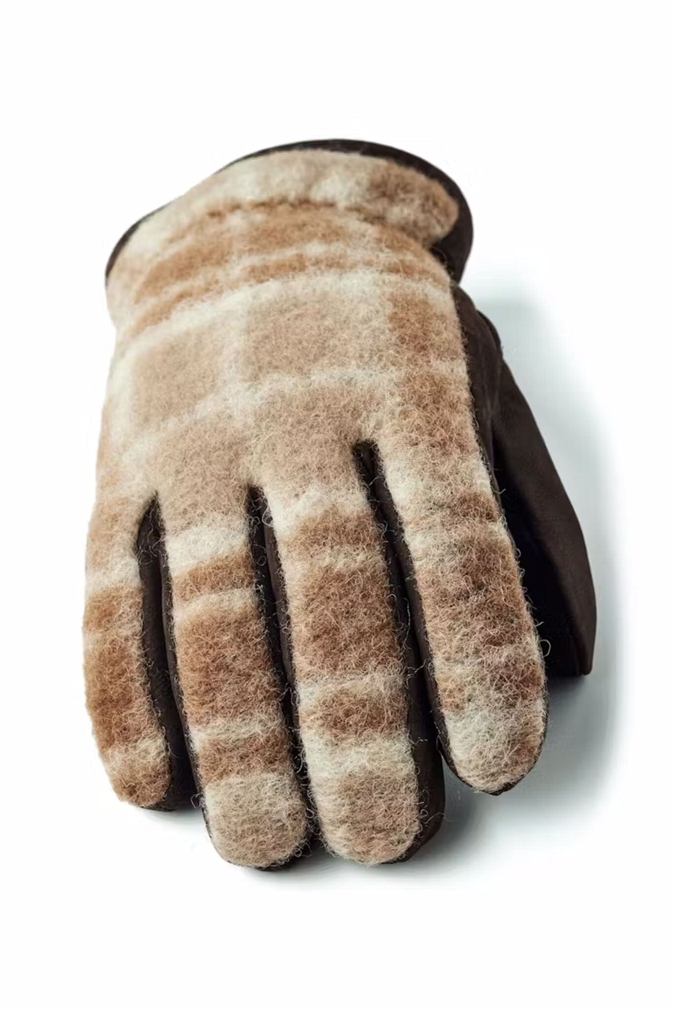 The top of a brown glove with plaid pattern on a white background