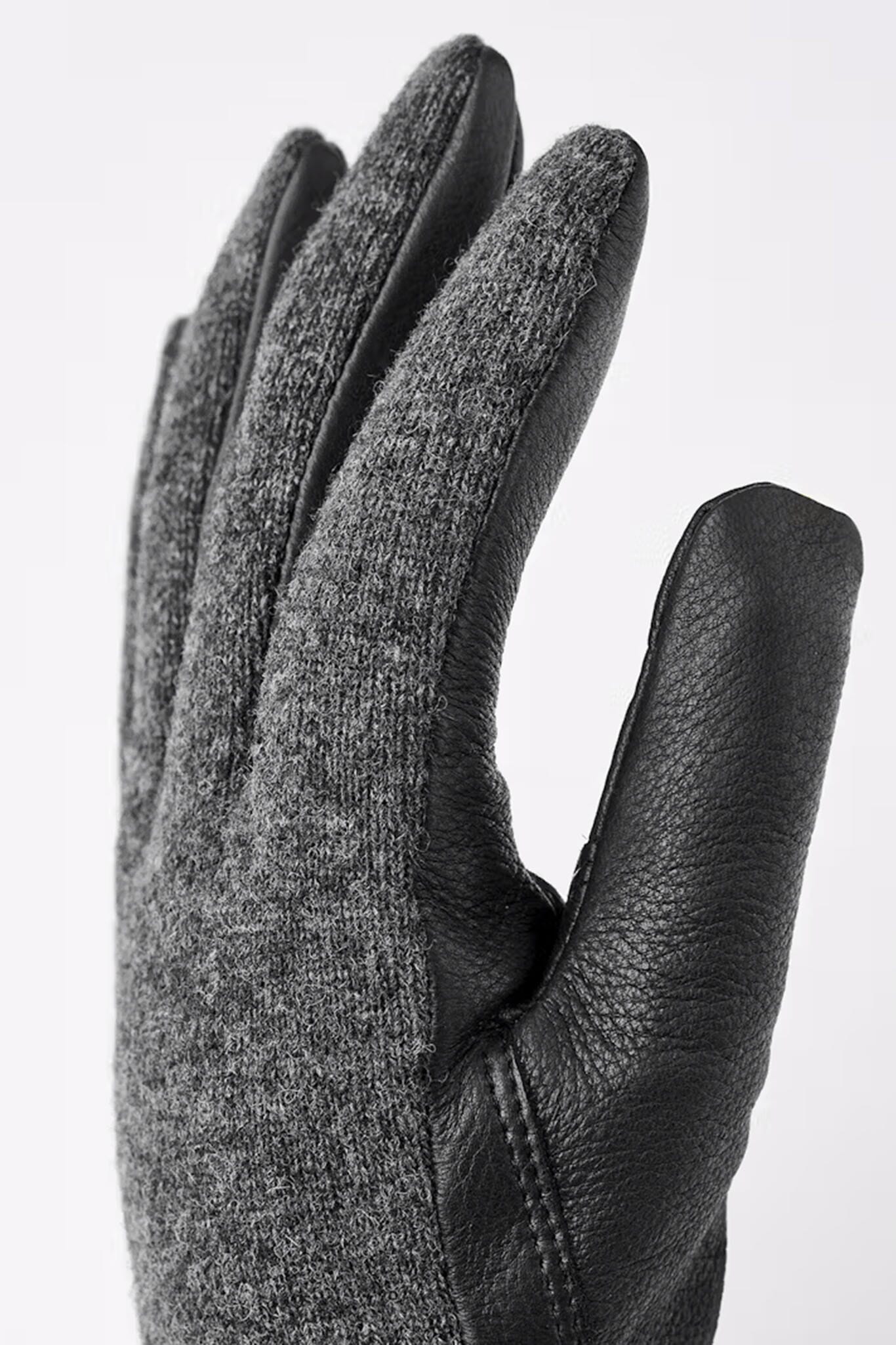 Mens gray glove with leather palm on a white background