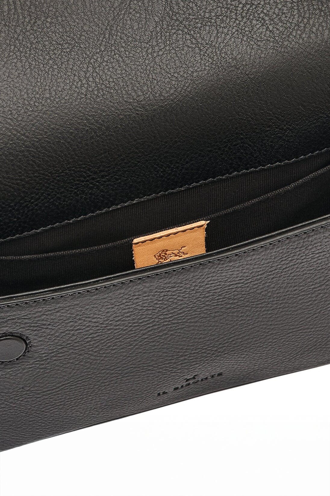A detailed shot of a black leather bag with interior pockets