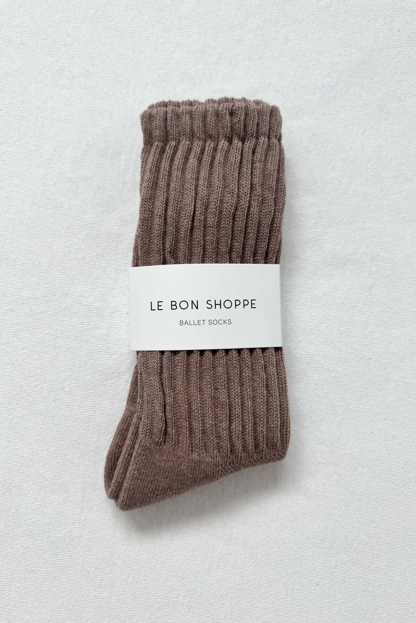 Pair of brown ballet socks with a 'Le Bon Shoppe' label on a light gray background