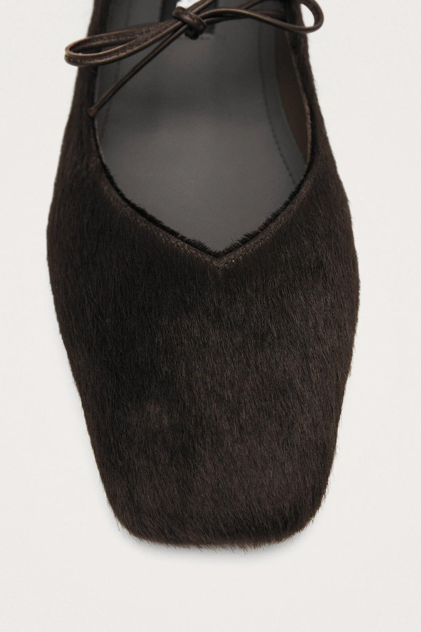 Close up of dark brown calf hair square toe women's flats