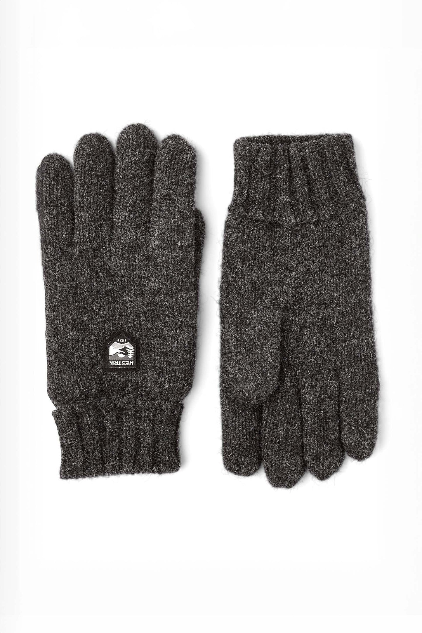 A pair of charcoal gray Hestra Basic Wool Gloves laid flat against a white background.