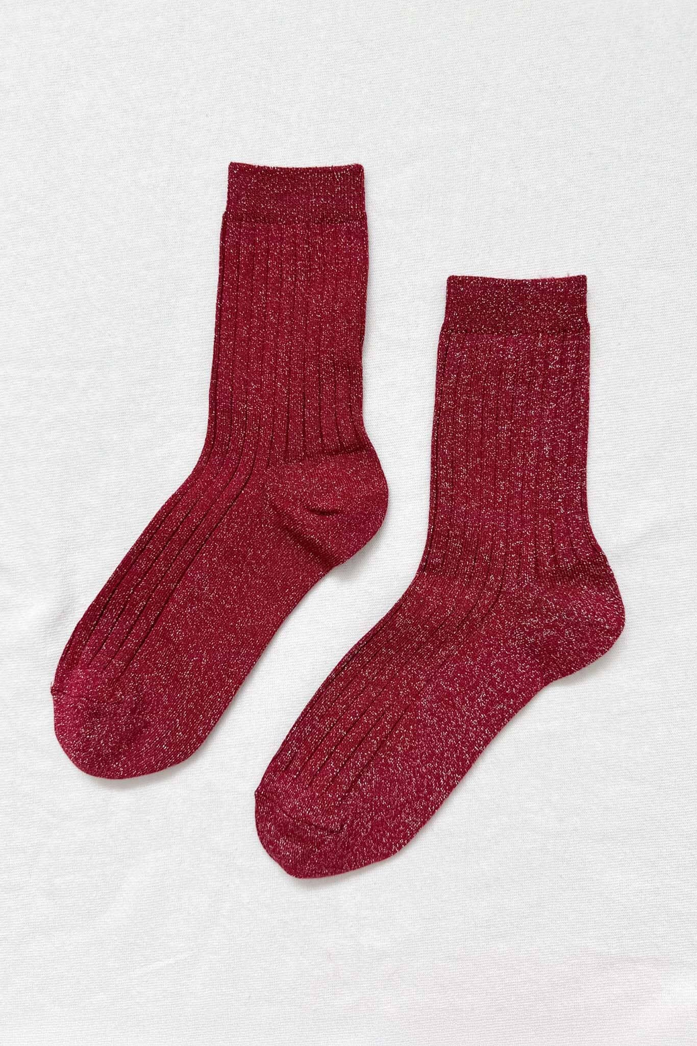 A pair of wine colored, ribbed cotton blend socks displayed against a white background.