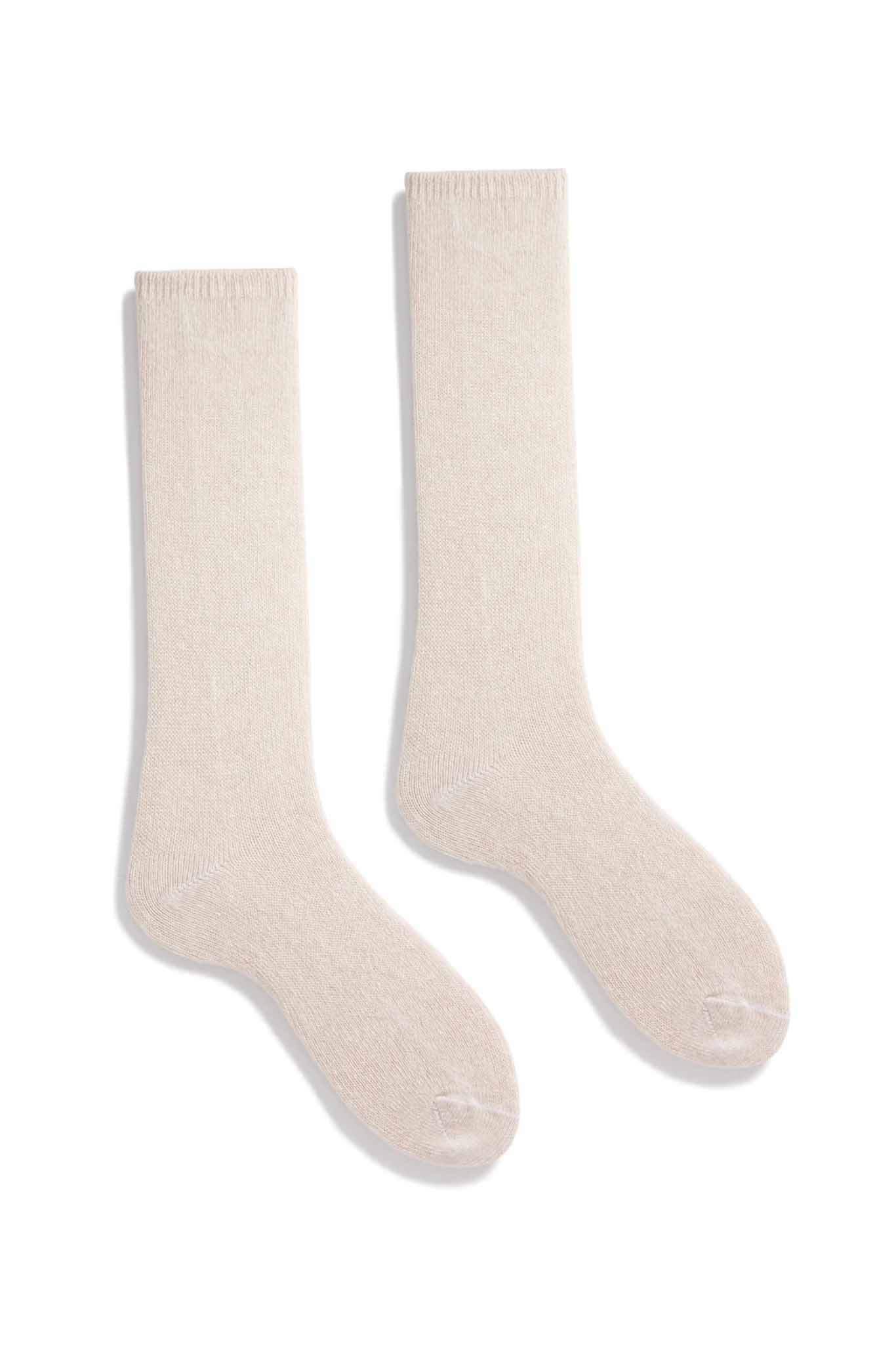 A pair of cream crew socks made of wool and cashmere, displayed against a white background.