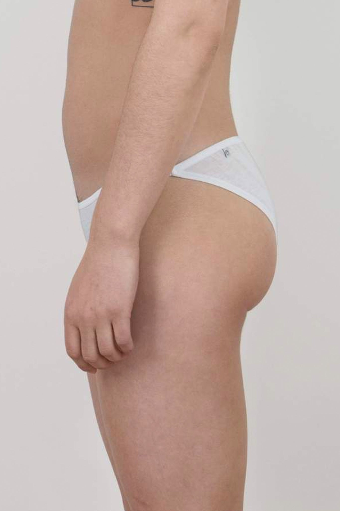 The side view of the white Oddobody bikini underwear