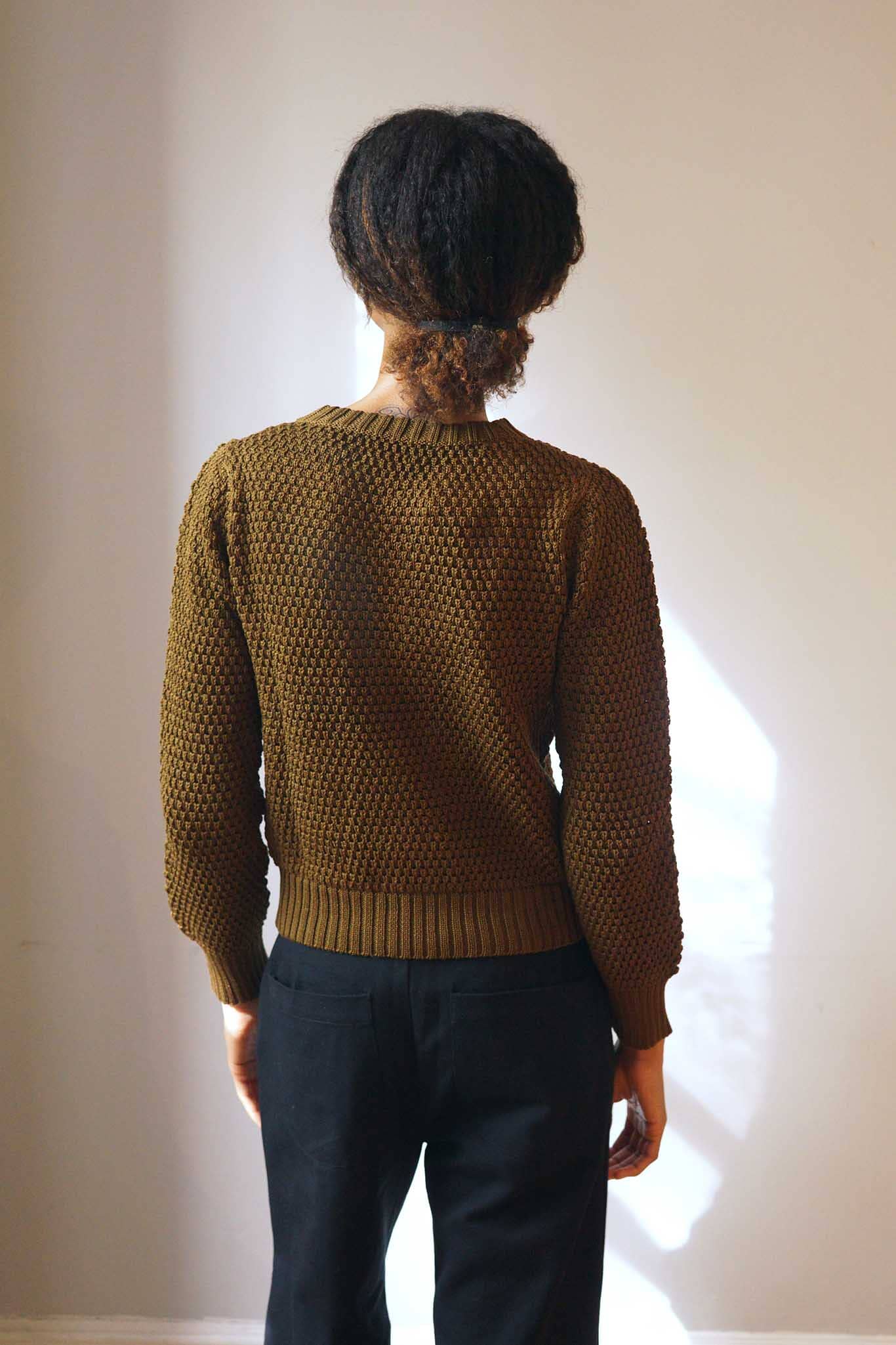 Textural cotton knit crewneck sweater. Made in peru.