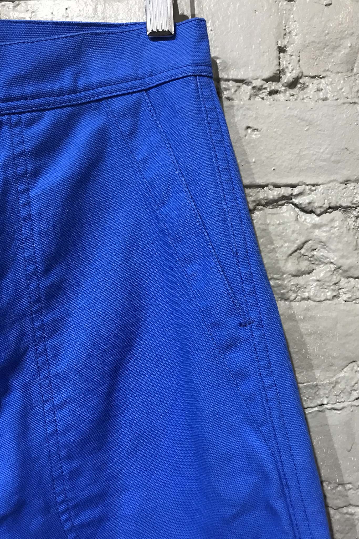 The pocket detail of the UQNATU cobalt blue high-rise wide-leg crop sailor pants