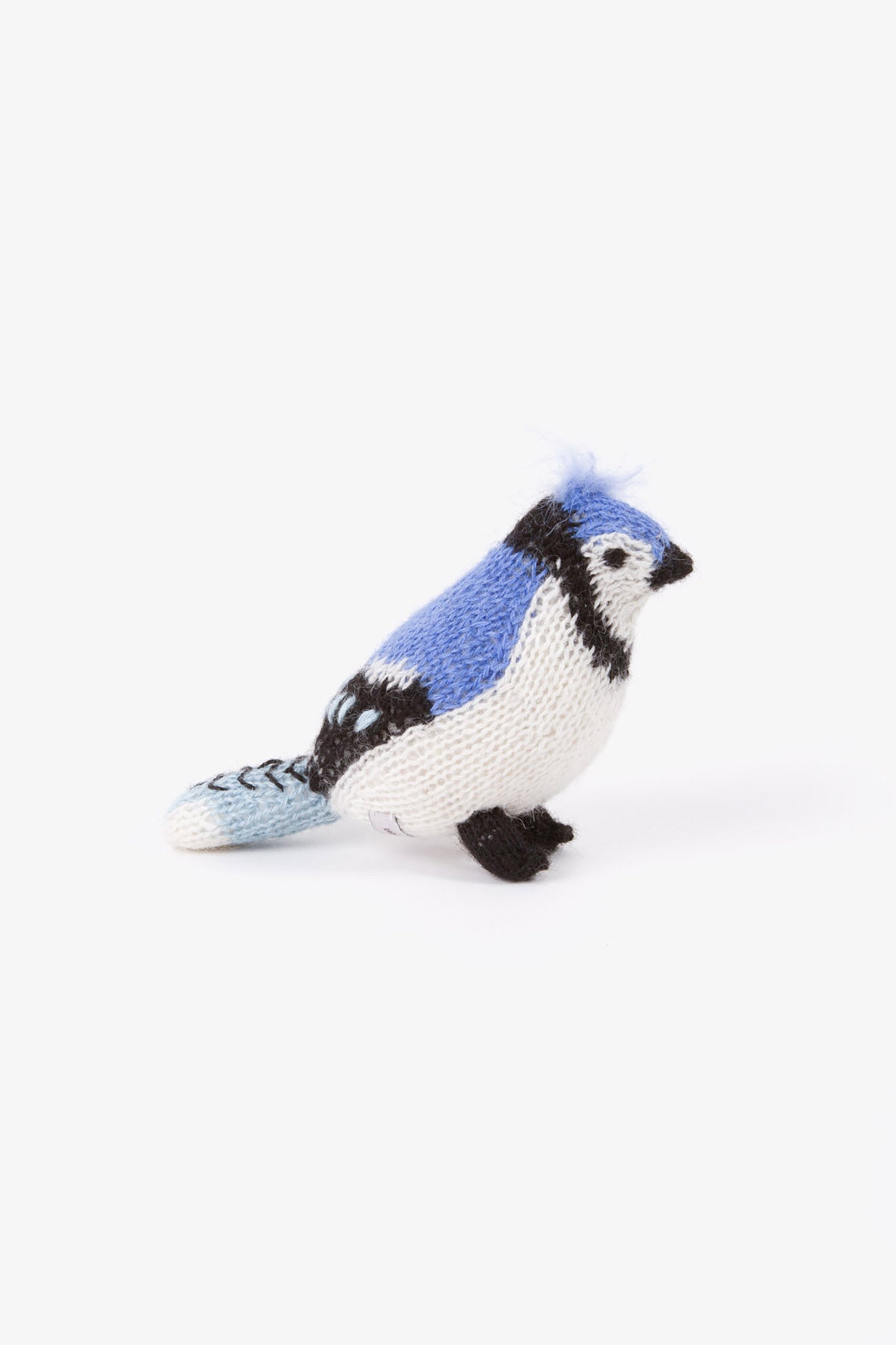 A blue felted blue jay bird toy