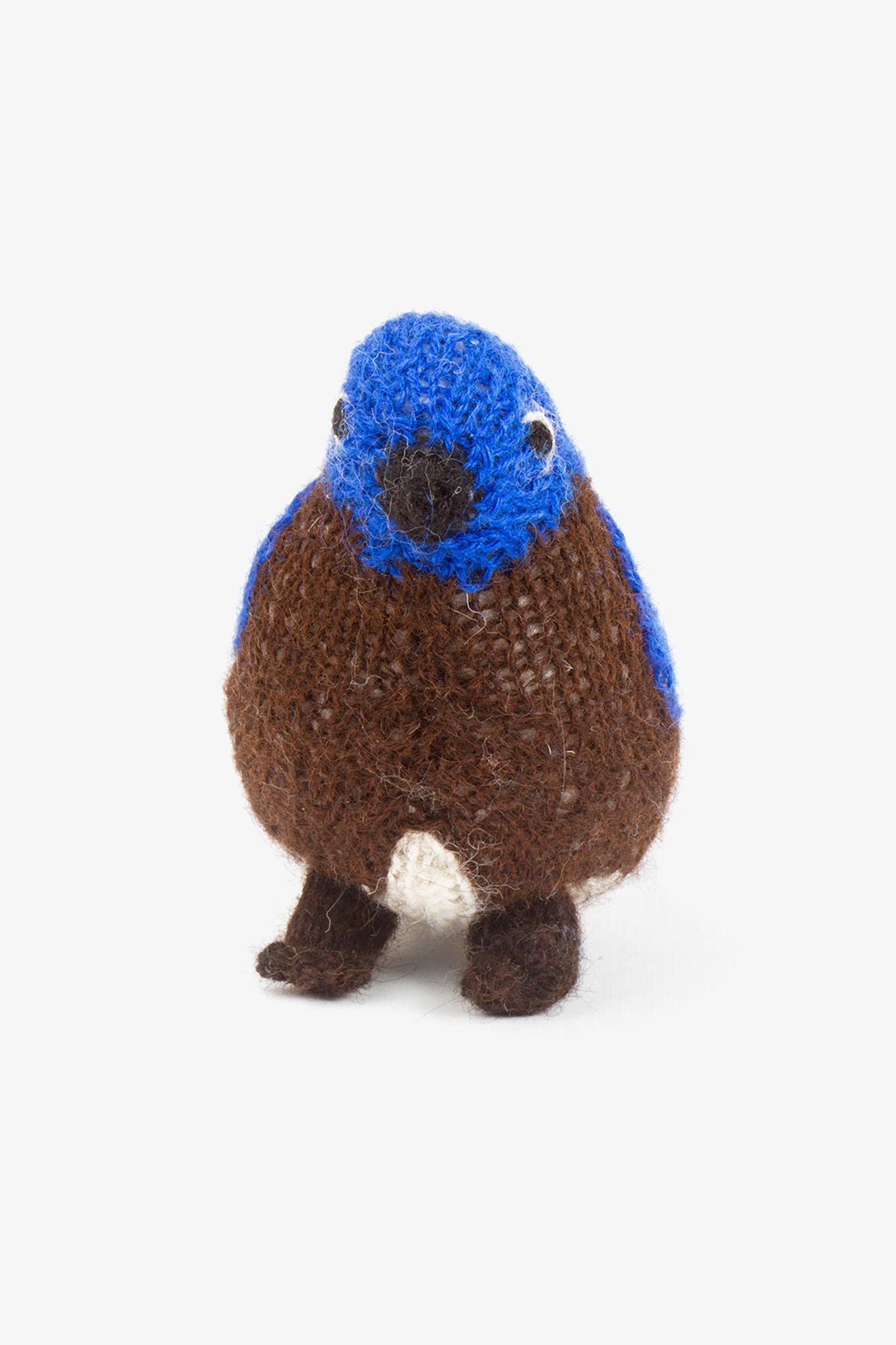 Hand-knit alpaca Eastern Bluebird plush toy with blue head and brown body.