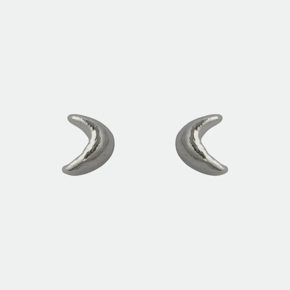Pair of silver crescent moon earrings on a light gray background