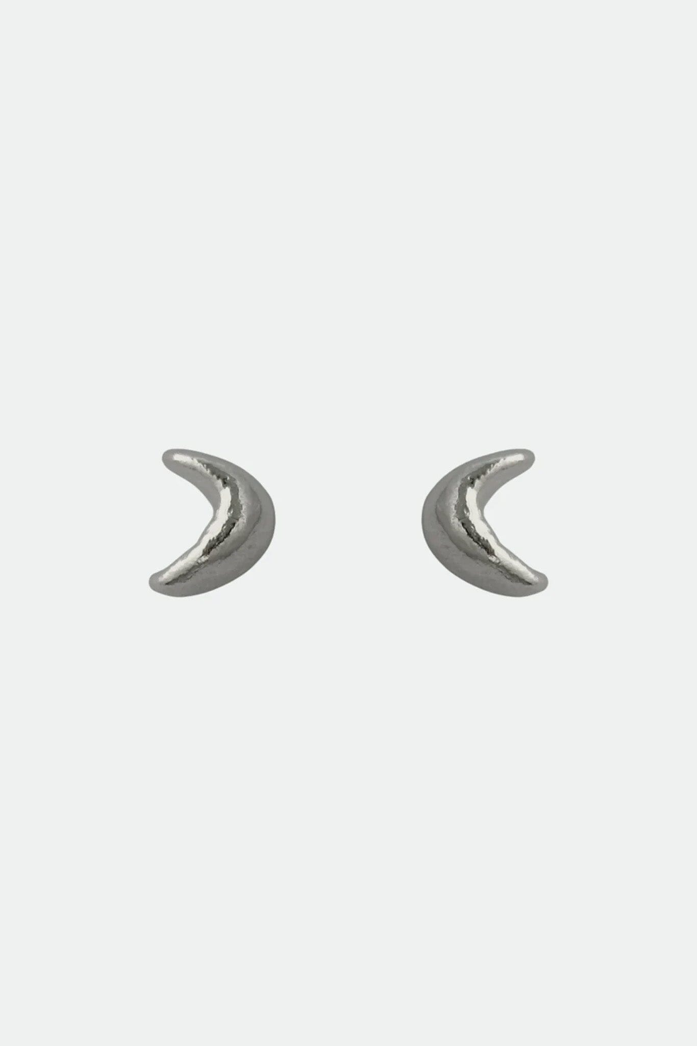 Pair of silver crescent moon earrings on a light gray background