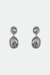 Pair of silver dome stud drop earrings on a light gray background