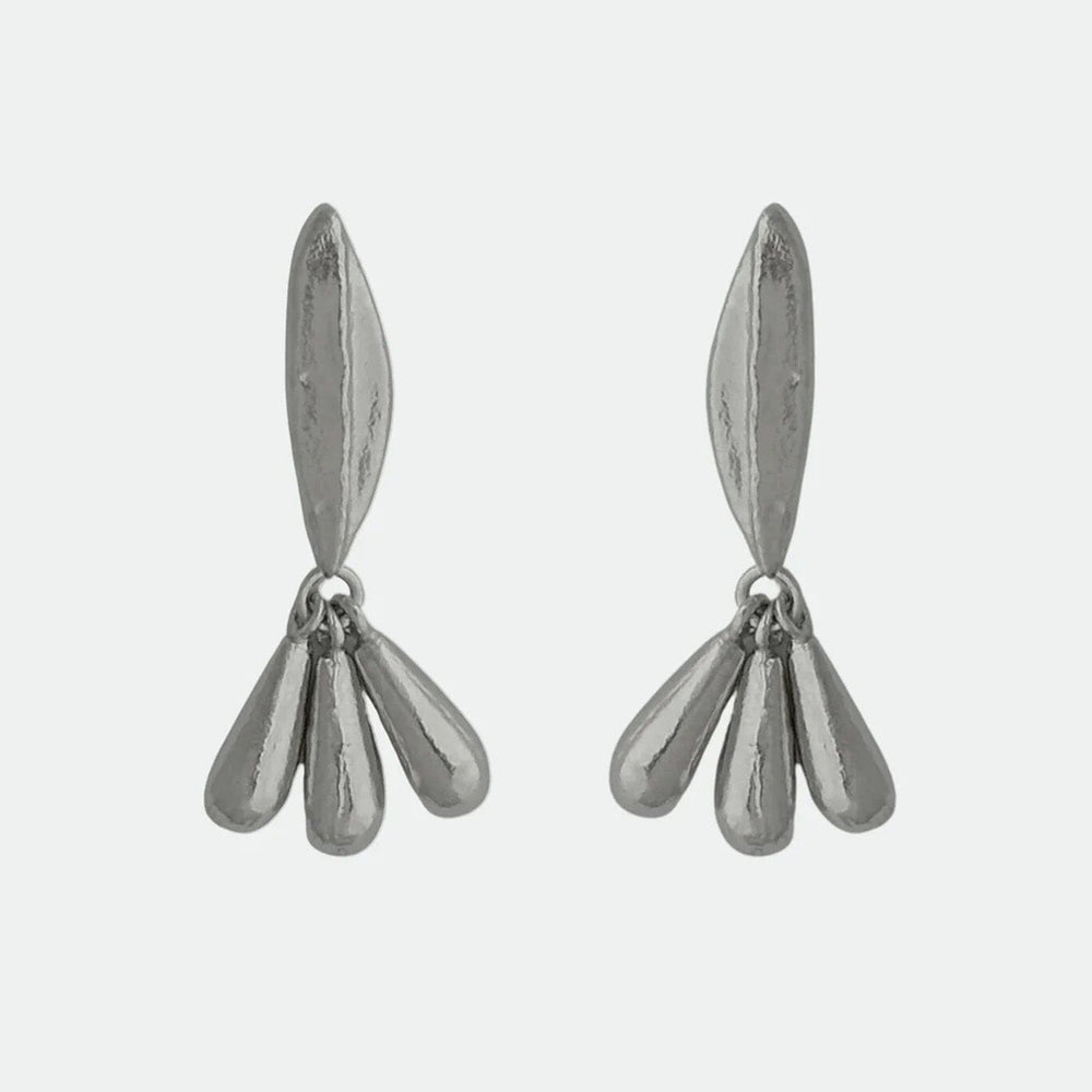 Pair of silver floral drop stud earrings on a light gray background