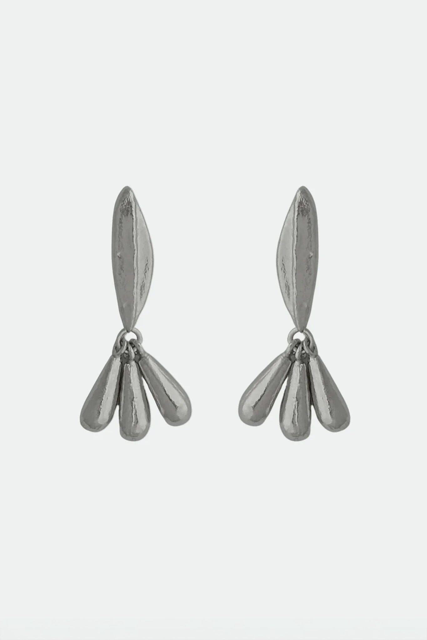 Pair of silver floral drop stud earrings on a light gray background