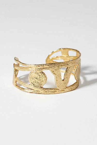 Textured, gold plated noturne wrap bracelet by COG. Available to purchase at M.Patmos Brooklyn. 