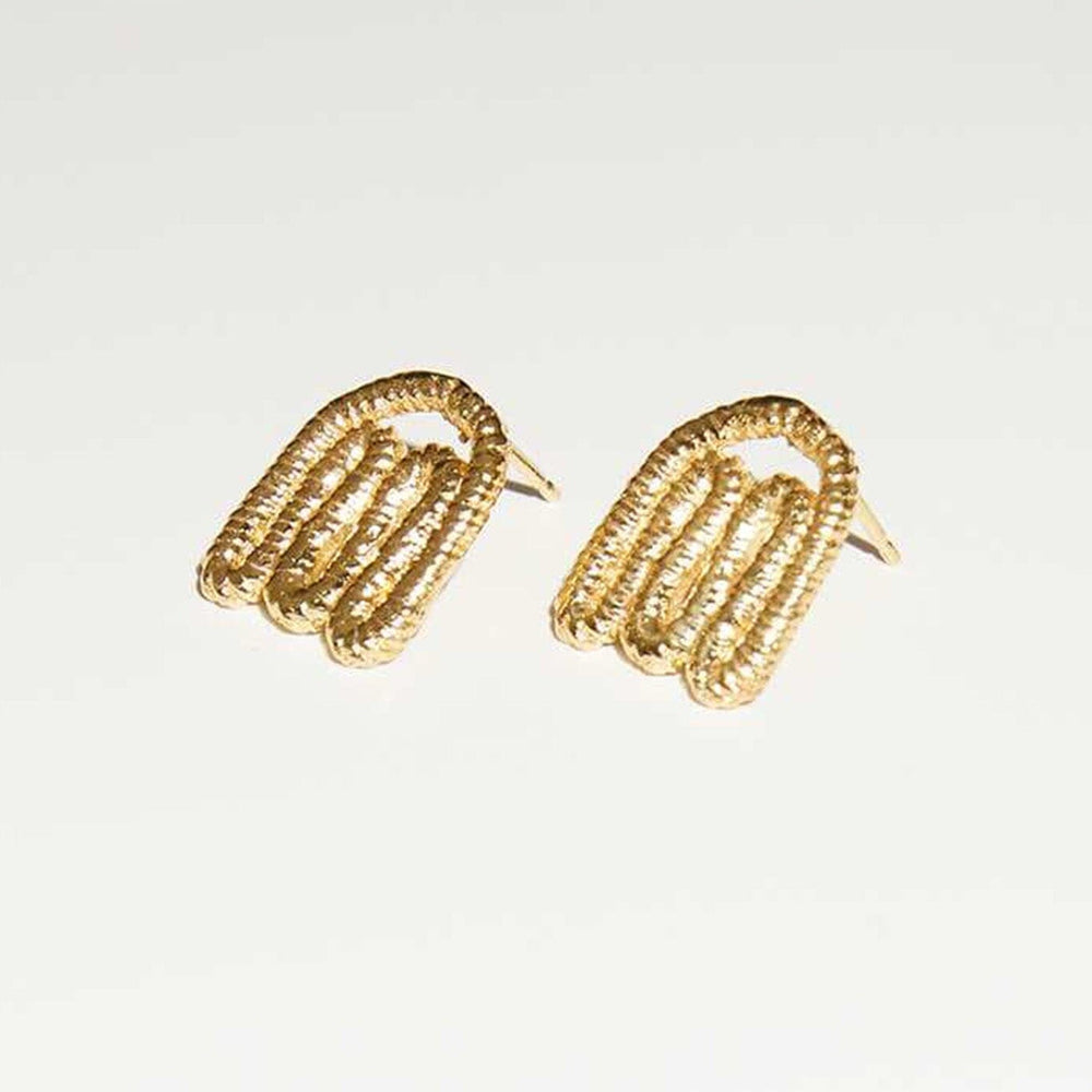 
                  
                    Organic shaped gold layer stud earrings by COG designs. Located at M.Patmos in Brooklyn.
                  
                