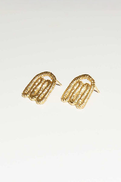 Organic shaped gold layer stud earrings by COG designs. Located at M.Patmos in Brooklyn.