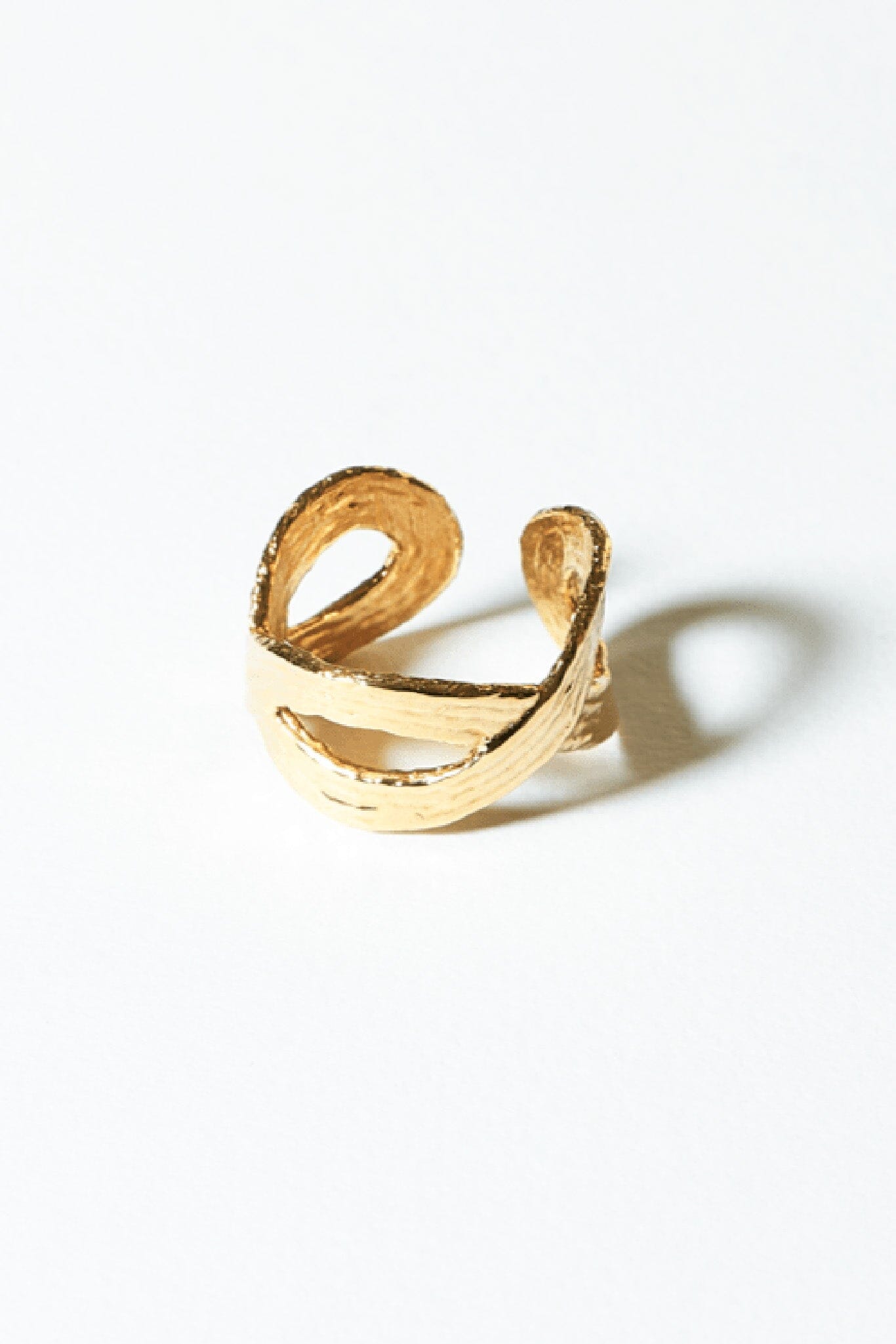 Textured 14k gold plated loop ring by COG. Available to purchase at M.Patmos.