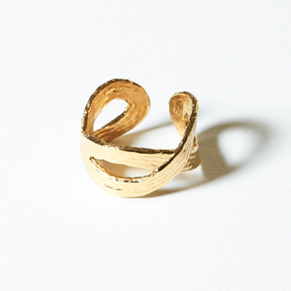 
                  
                    Textured 14k gold plated loop ring by COG. Available to purchase at M.Patmos.
                  
                