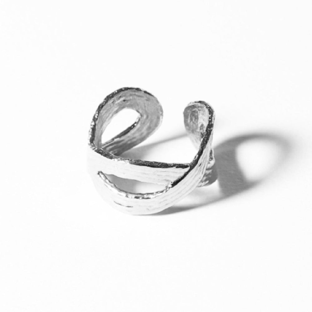 
                  
                    Sterling Silver loop ring by Cog. Available at M.Patmos.
                  
                