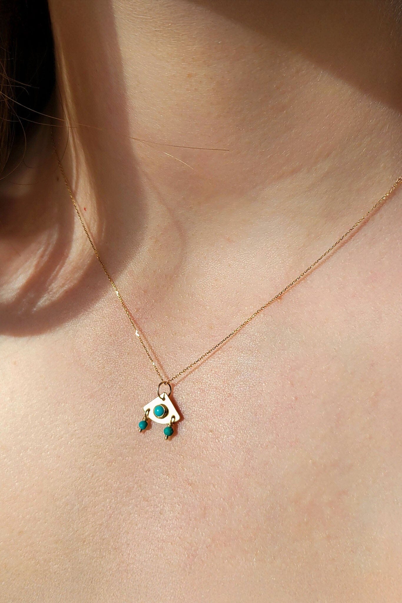 Necklace with a small pendant worn around the neck