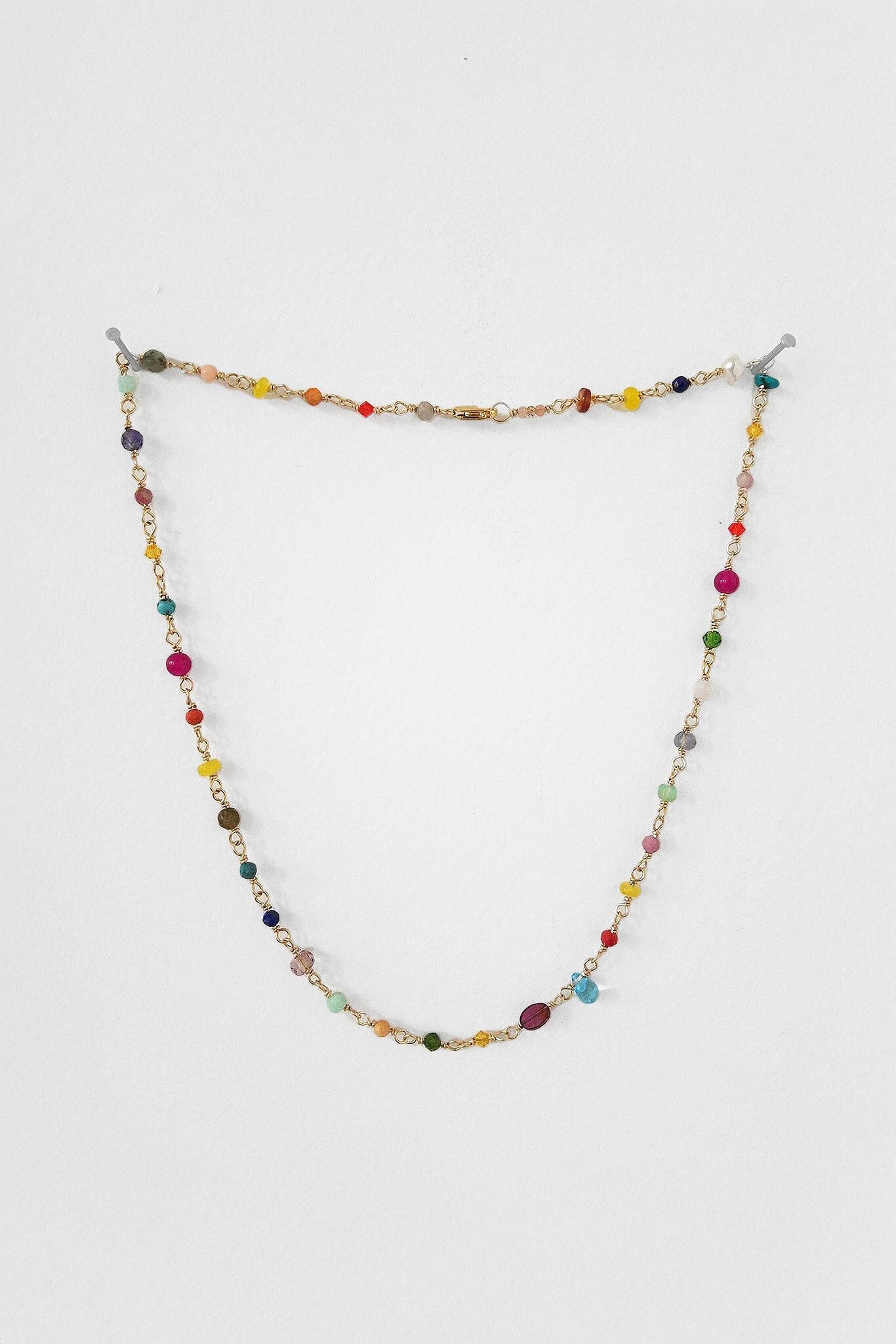 Colorful, everday necklace featuring a rainbow of briolettes on 14k gold filled wire. Available at M.Patmos in Brooklyn.