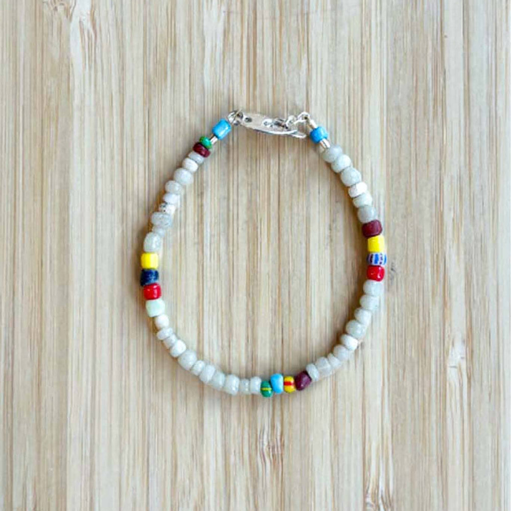 A white and multi-color beaded bracelet with a silver clasp