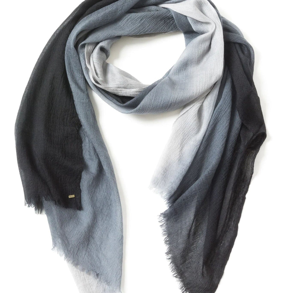 Gradient cashmere scarf transitioning from black to gray on a white background