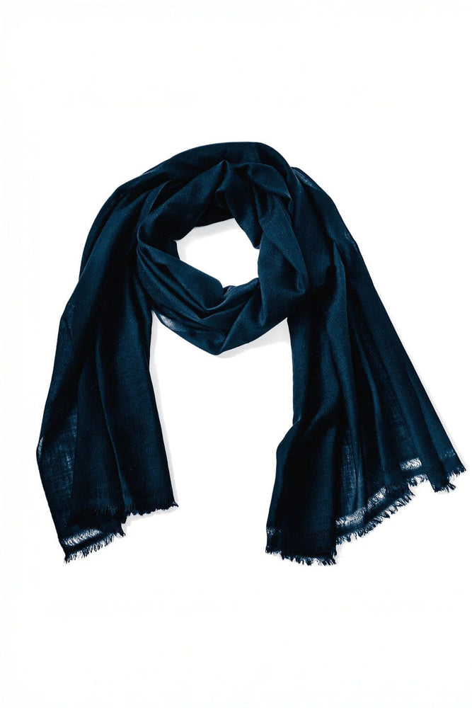 Navy blue cashmere and wool scarf on a white background