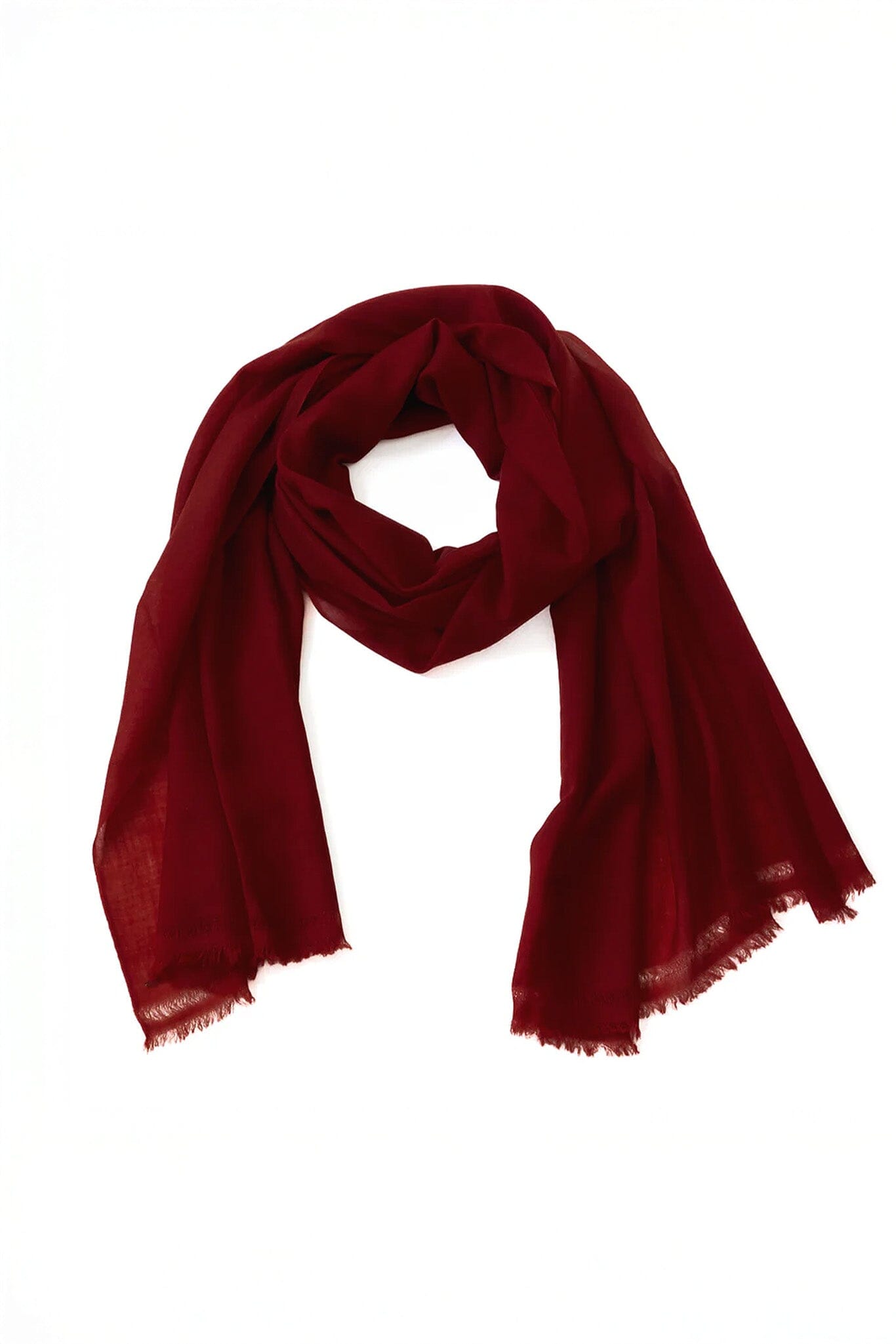 Dark red merino wool scarf on a white background