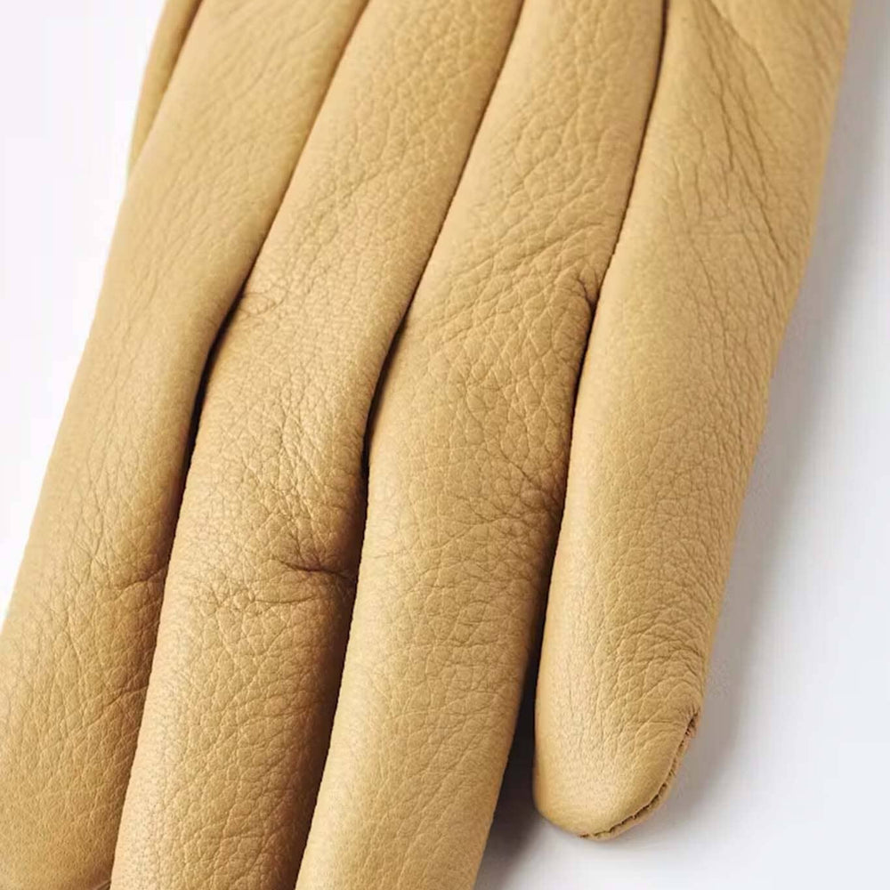 Tan leather glove on a white background
