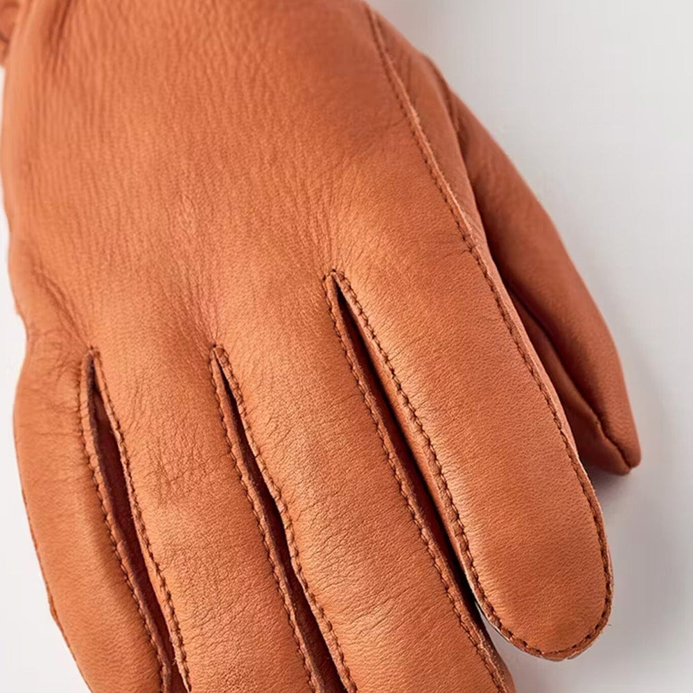 A close up of a women's cork brown insulated winter glove