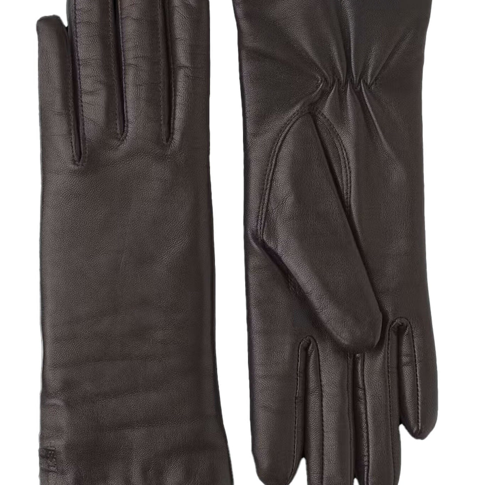 Pair of black leather gloves on a white background