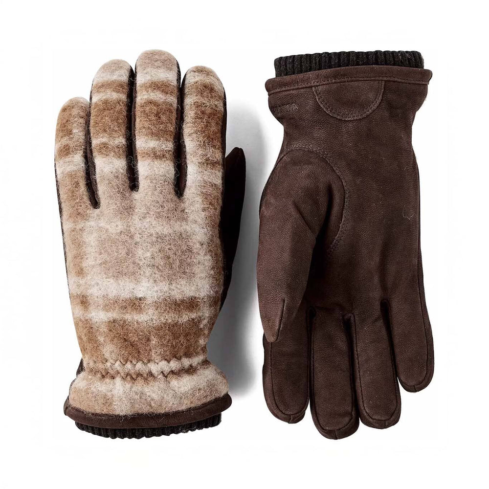 Pair of brown gloves with plaid pattern on a white background