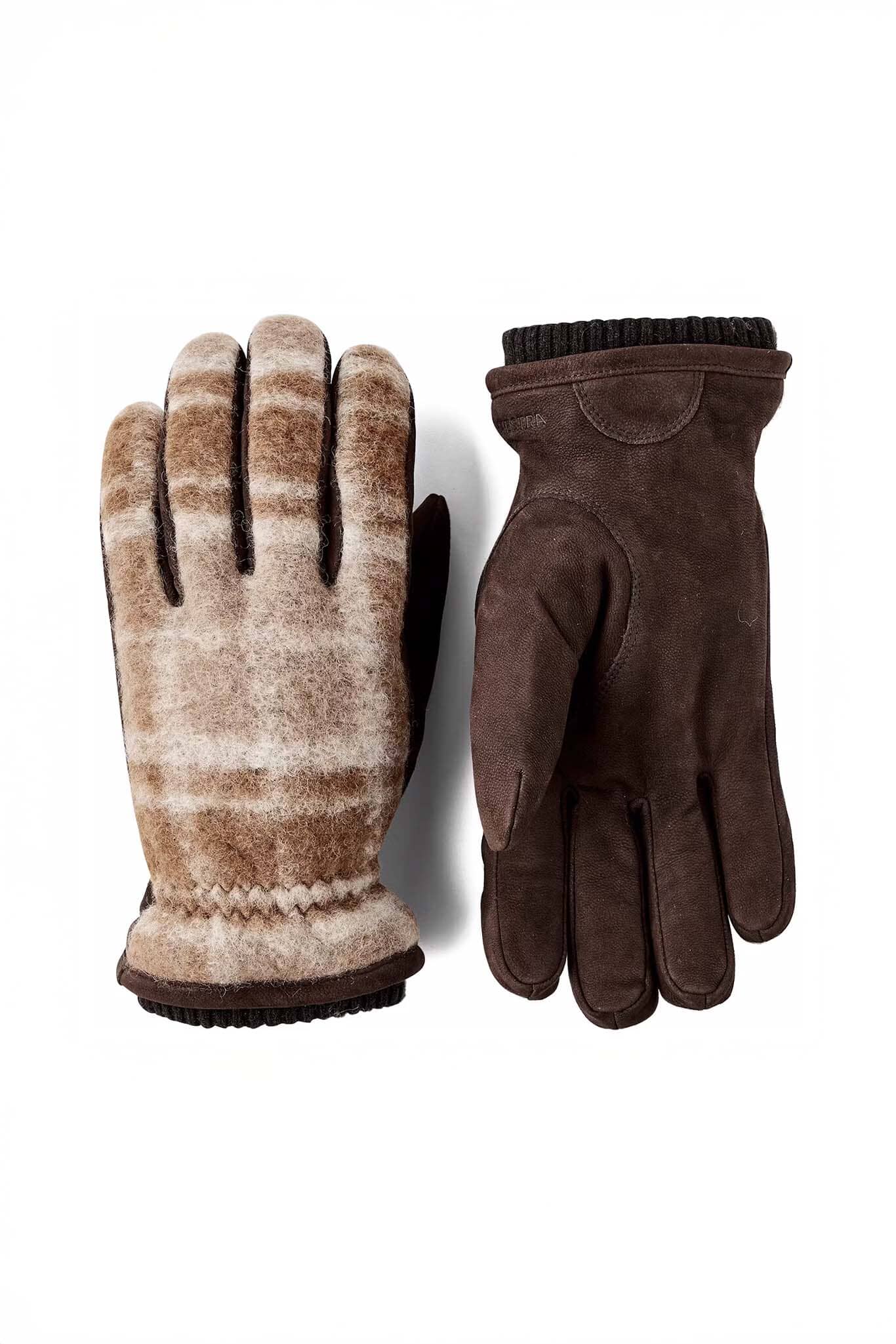 Pair of brown gloves with plaid pattern on a white background