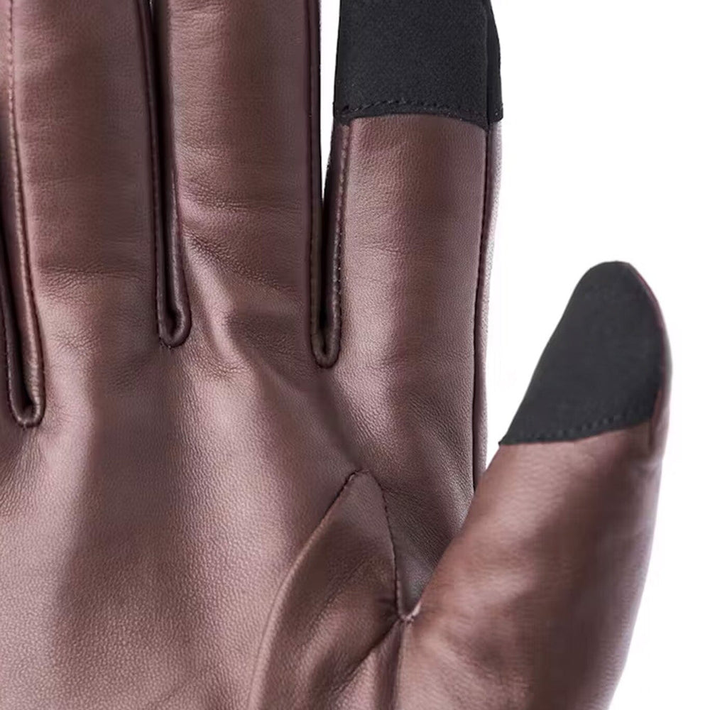 
                  
                    Brown leather glove with black touch screen tips on a white background
                  
                