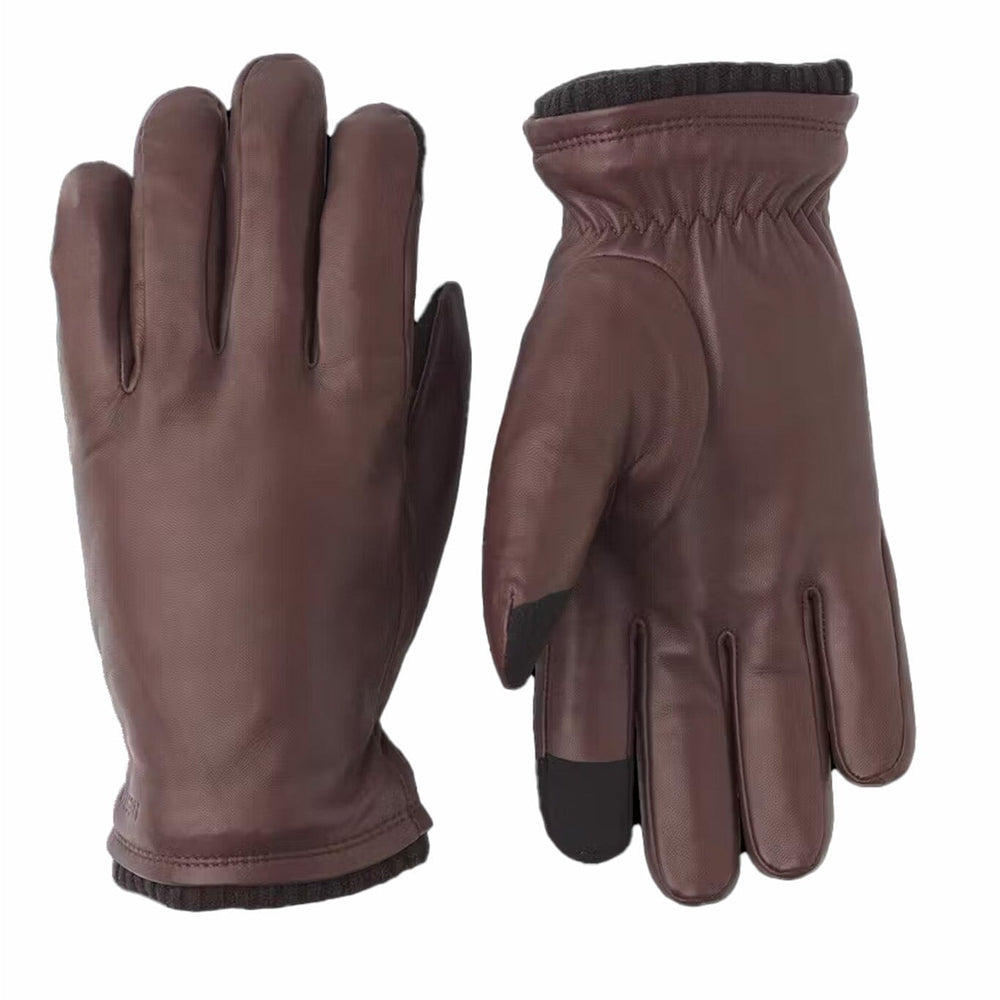Pair of brown leather gloves on a white background