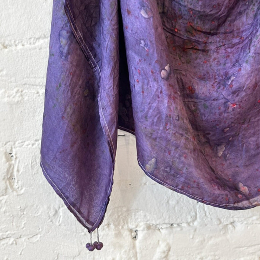 Purple tie dye silk scarf with tassel details on the edge