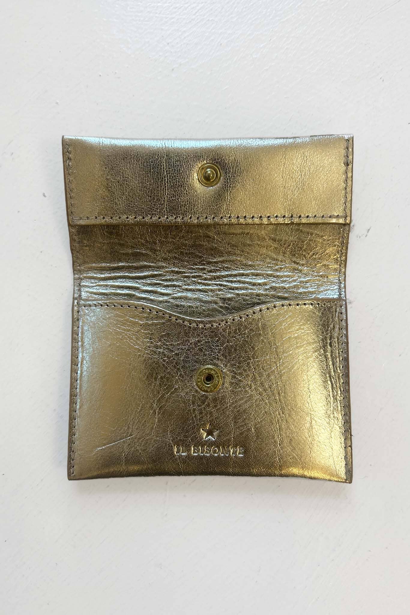 Gold metallic pouch with 'Il Bisonte" branding on a white background