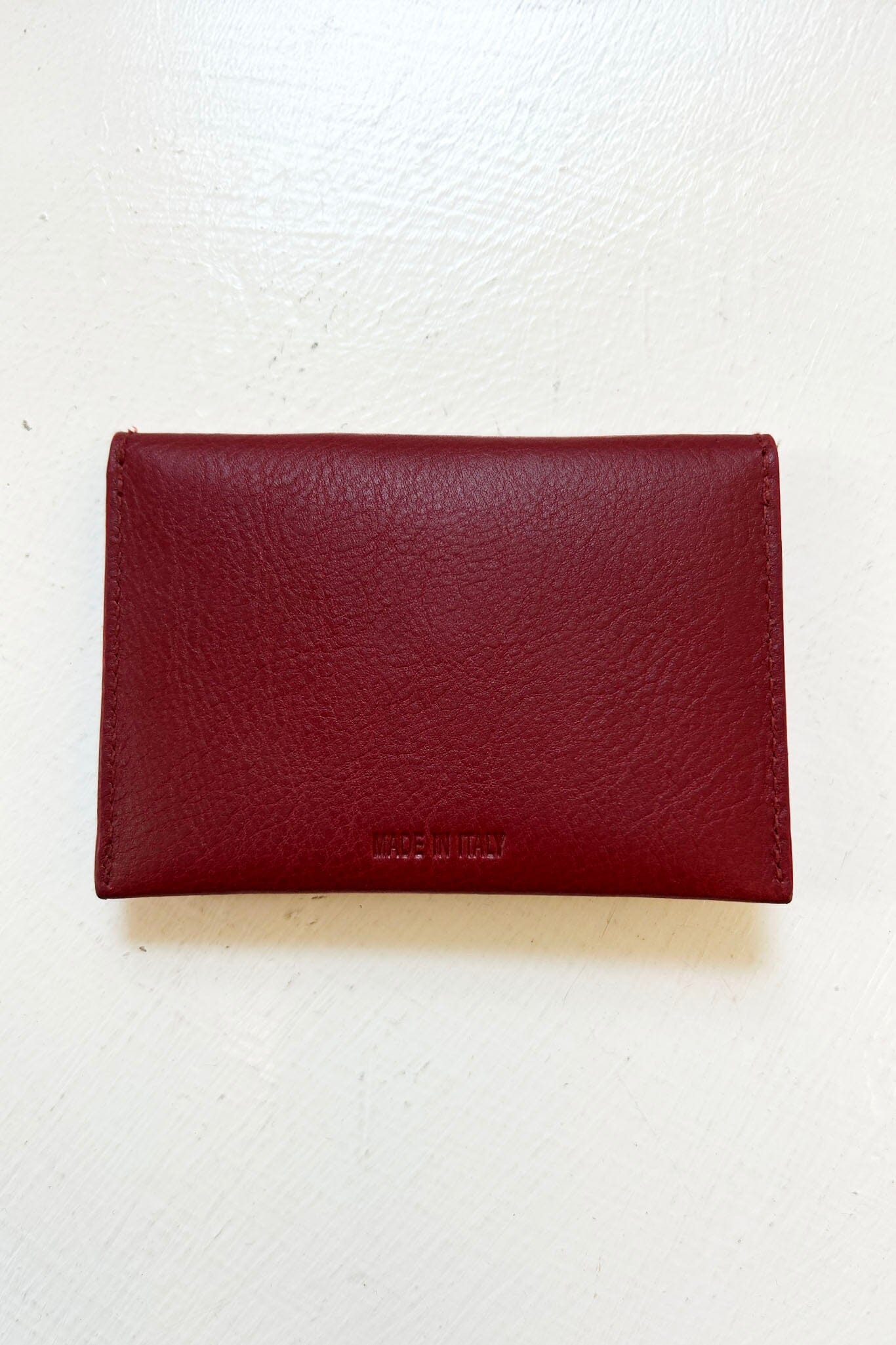 Red leather wallet on a white background