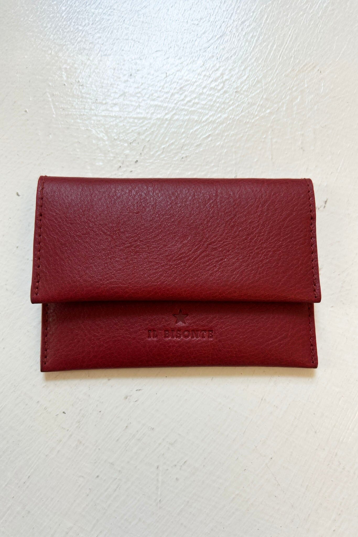 Red leather wallet on a white background