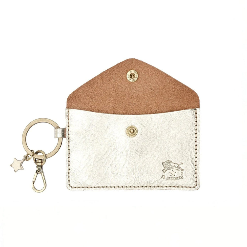A small silver leather wallet with suede interior and a gold keychain 