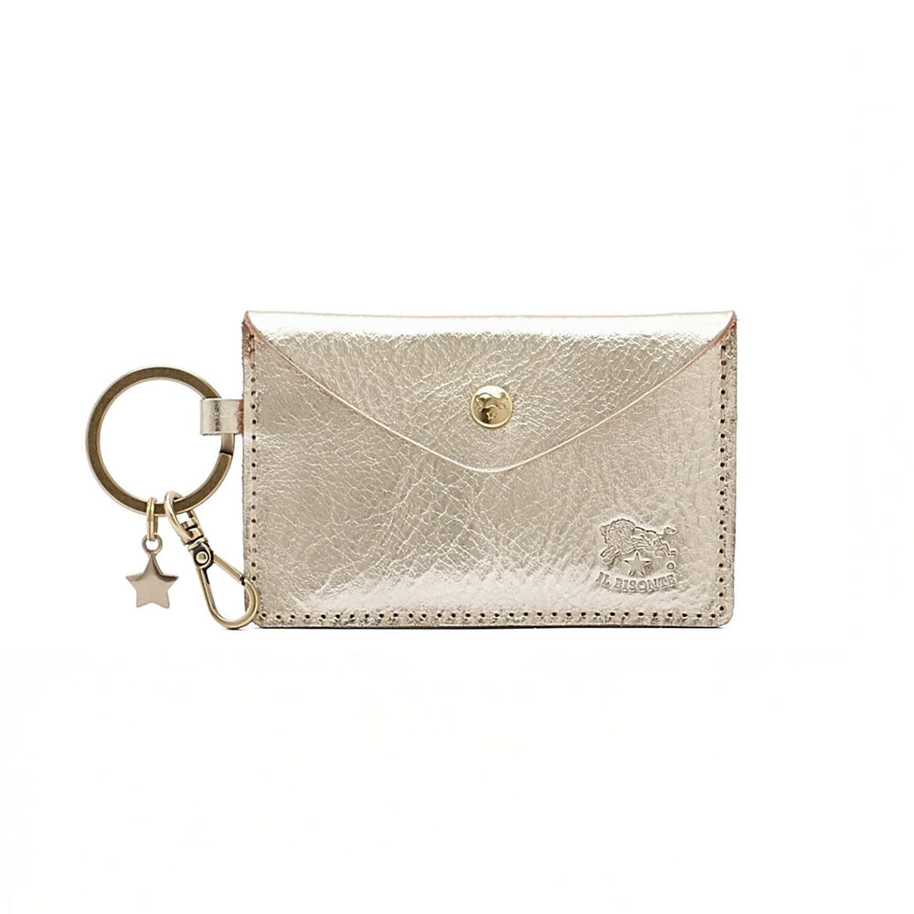 A small silver leather wallet with a gold keychain