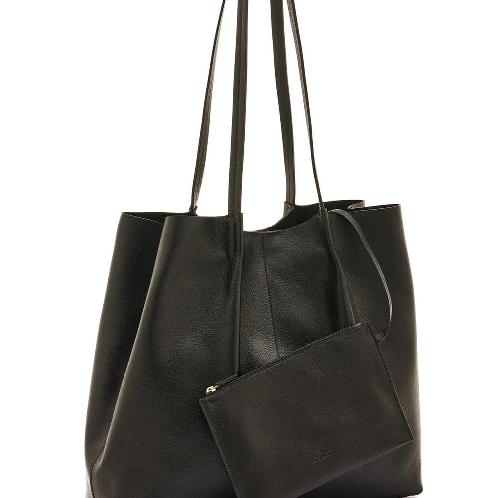 Black leather tote bag with a matching interior pouch on a white background