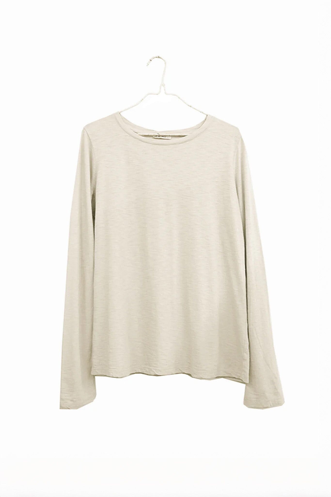Beige long-sleeve shirt on a hanger against a white background