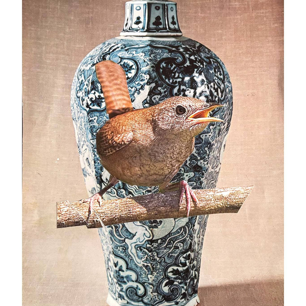 Decorative vase with intricate patterns and a bird perched on top