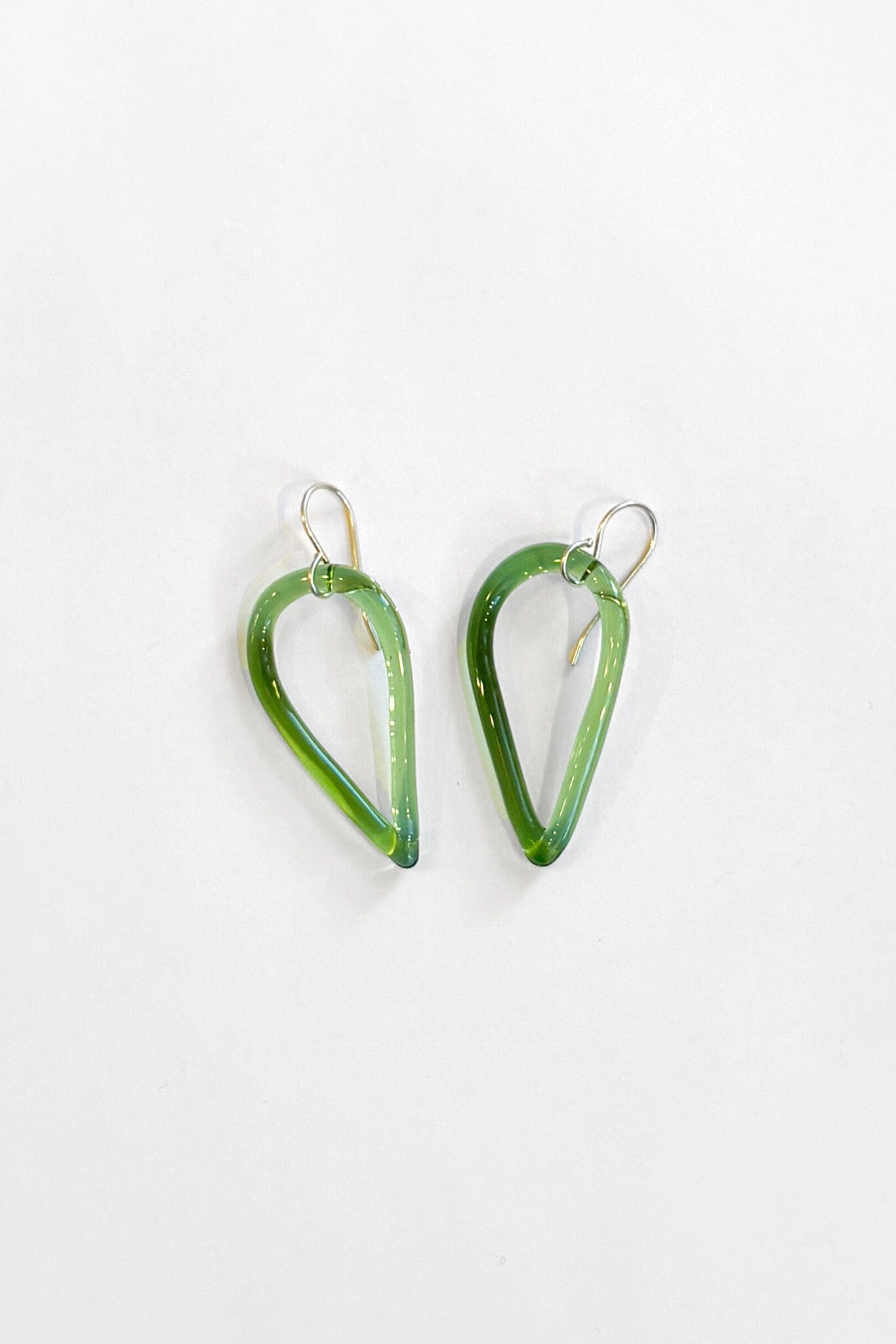 Green teardrop-shaped earrings on a white background